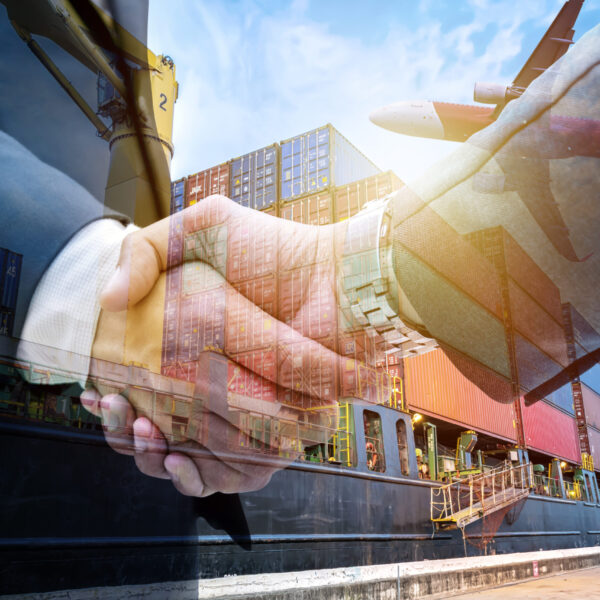 Double exposure business shake hand with Container warehouse background for delivery shipment transport, import export to global logistics concept. by boat and plane.